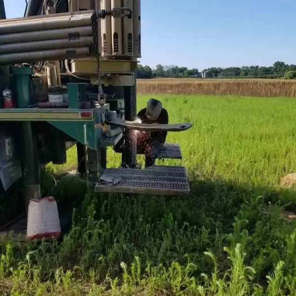 Herr Well Drilling technician welding a repair on the drill rig platform out in the field